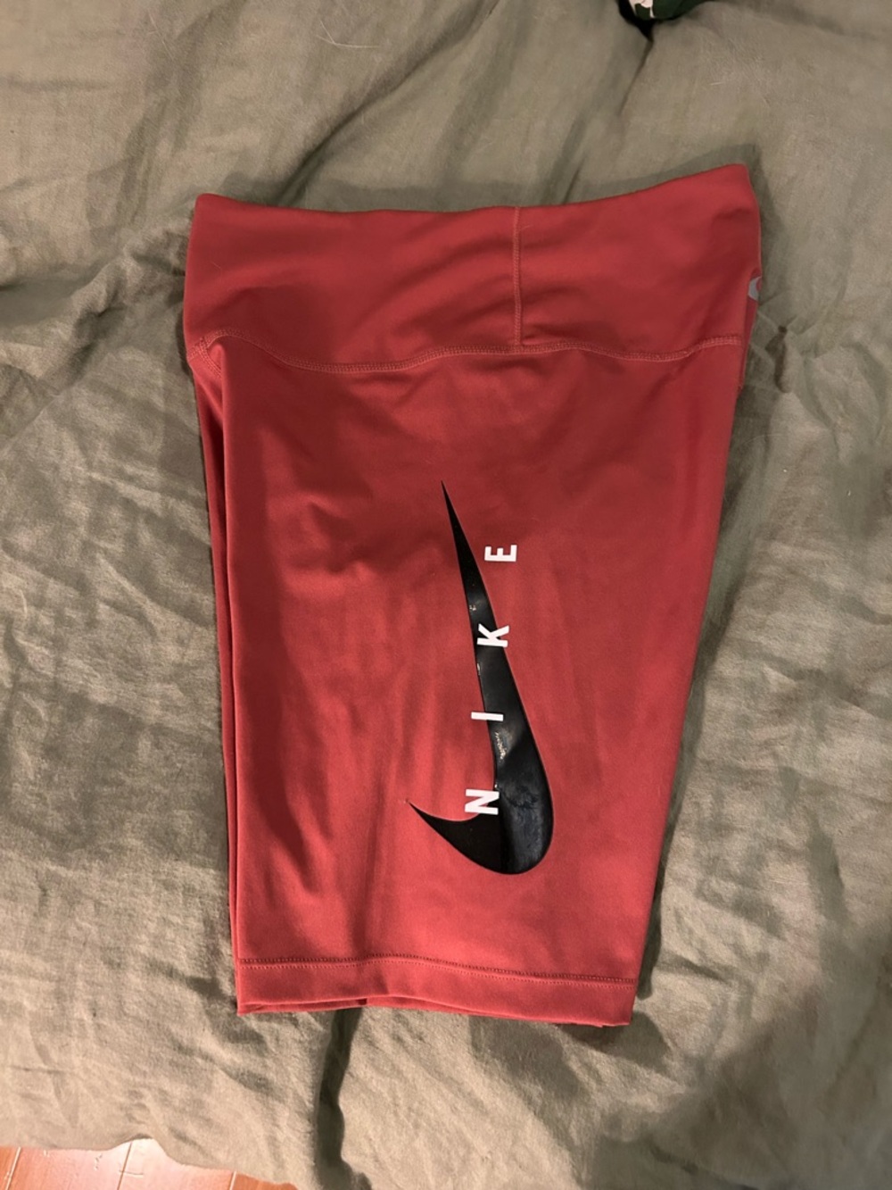 Nike Pink Bike Shorts with Black Swoosh and White Lettering